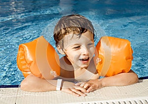 Little cute boy in swimming pool