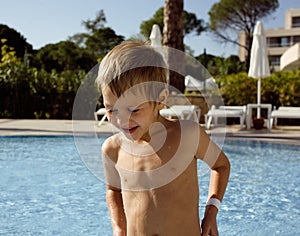 Little cute boy in swimming pool