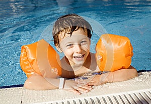 Little cute boy in swimming pool close up