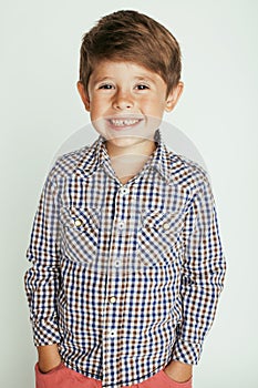 Little cute boy on white background gesture