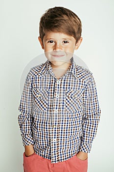 Little cute boy on white background gesture smiling close up