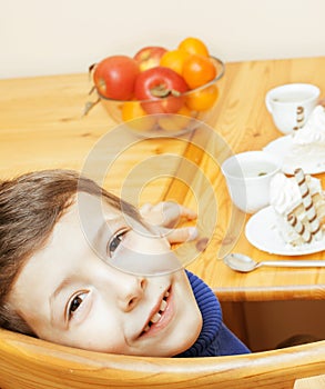 Little cute boys eating dessert on wooden kitchen. home interior. smiling adorable friendship together forever friends