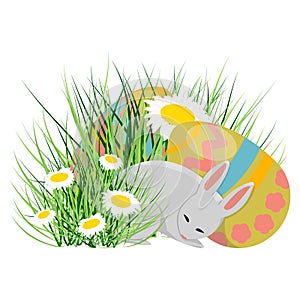 A little cute bunny sleeps near Easter eggs. Easter eggs, grass and daisies.