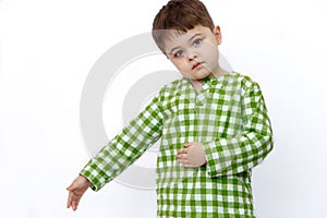 Little cute Caucasian boy on white isolated background posing, showing emotions and smiling