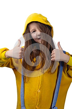 Little cute cheerful girl 10 years old posing in yellow pajamas. Studio photo