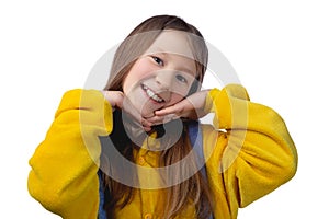 Little cute cheerful girl 10 years old posing in yellow pajamas. Studio photo