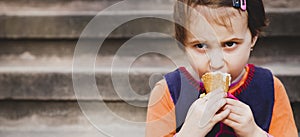 Little cute child girl eating ice cream. Food, dessert, childhood, satisfaction, carelessness concept