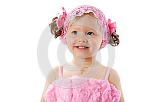 Little cute child girl with with pink bows isolated on white background.