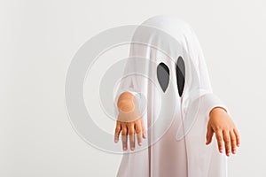 Little cute child with white dressed costume halloween ghost scary