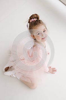 Little cute girl in class in ballet studio