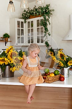 Little cute girl eats an apple. Healthy food concept. Vitamins in natural products