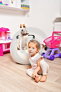 Little cute girl with her dog