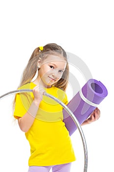 Little cute girl with hula hoop and gym mat. Isolated on white background.