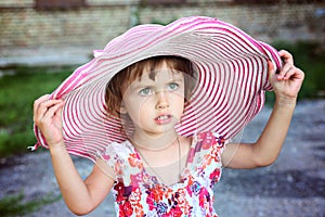 Little cute girl in pink hat