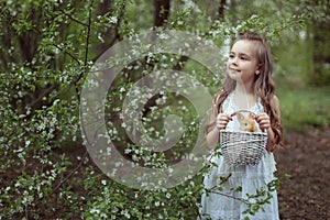 Little cute girl with a rabbit