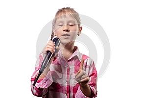 Little cute girl singing into a microphone on a white background