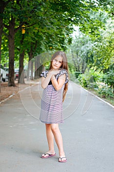 Little cute girl street city lifestyle shooting, summer, smiling at camera