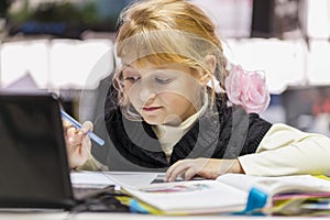 Little cute girl studying