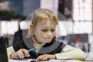 Little cute girl studying