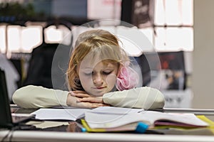 Little cute girl studying