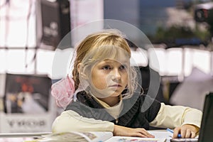 Little cute girl studying