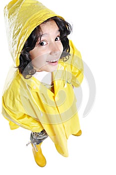 Little cute girl with yellow hood