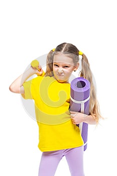 Little cute happy girl with dumbbell and gymnastic mat. Isolated on white background.