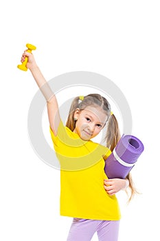Little cute happy girl with dumbbell and gymnastic mat. Isolated on white background.