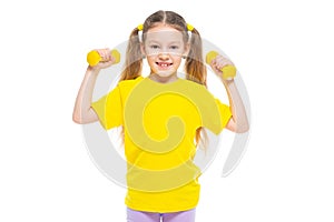 Little cute happy girl with dumbbells. Isolated on white background.