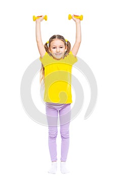 Little cute happy girl with dumbbells. Isolated on white background.