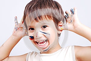 Little cute kid with colors on his face