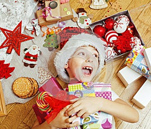 Little cute kid in santas red hat with handmade