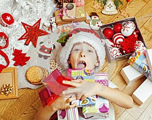 Little cute kid in santas red hat with handmade