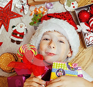 Little cute kid in santas red hat with handmade