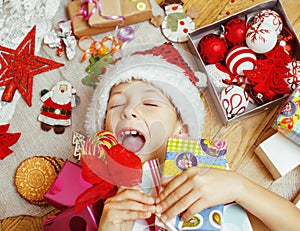 Little cute kid in santas red hat with handmade