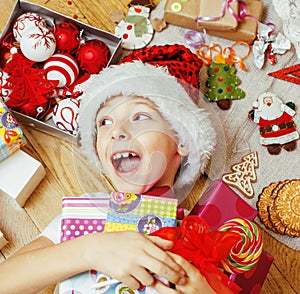 Little cute kid in santas red hat with handmade