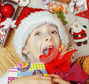 Little cute kid in santas red hat with handmade