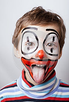 Little cute real boy with facepaint like clown