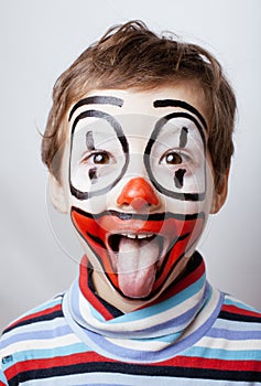 Little cute real boy with facepaint like clown