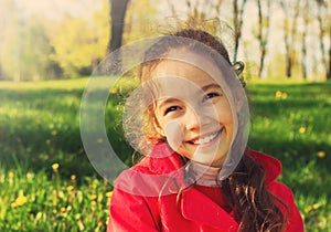 Little cute schoolgirl having fun at sunset.