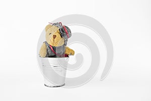 Little cute teddy beart in metal bucket