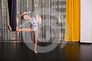 Little dancer in a aerial yoga hammock