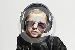 Little deejay. funny boy in sunglasses and headphones