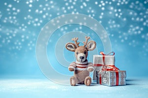 Little deer toy with wrapped Christmas gifts, on blue background, with copy space. Christmas and New Year background, AI