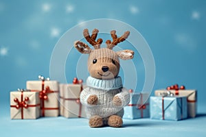 Little deer toy with wrapped Christmas gifts, on blue background, with copy space. Christmas and New Year background, AI