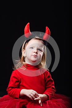 Little devil on dark background