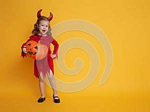 Little devil with a pumpkin