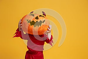 Little devil with a pumpkin