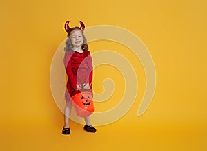 Little devil with a pumpkin