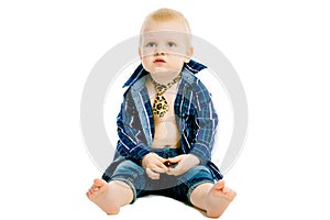 Little dissatisfied boy in a plaid shirt